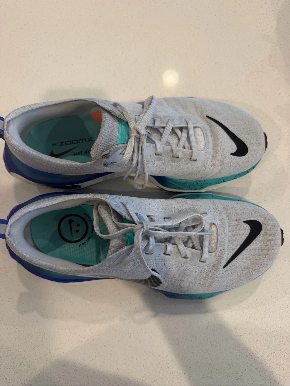 Nike Mens size 8 or Women’s 9.5 Grey ZoomX Invincible Sneakers with Blue Accents